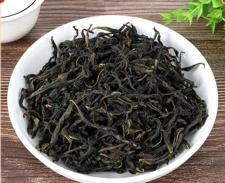 Phoenix Dancong tea leaves on a white dish